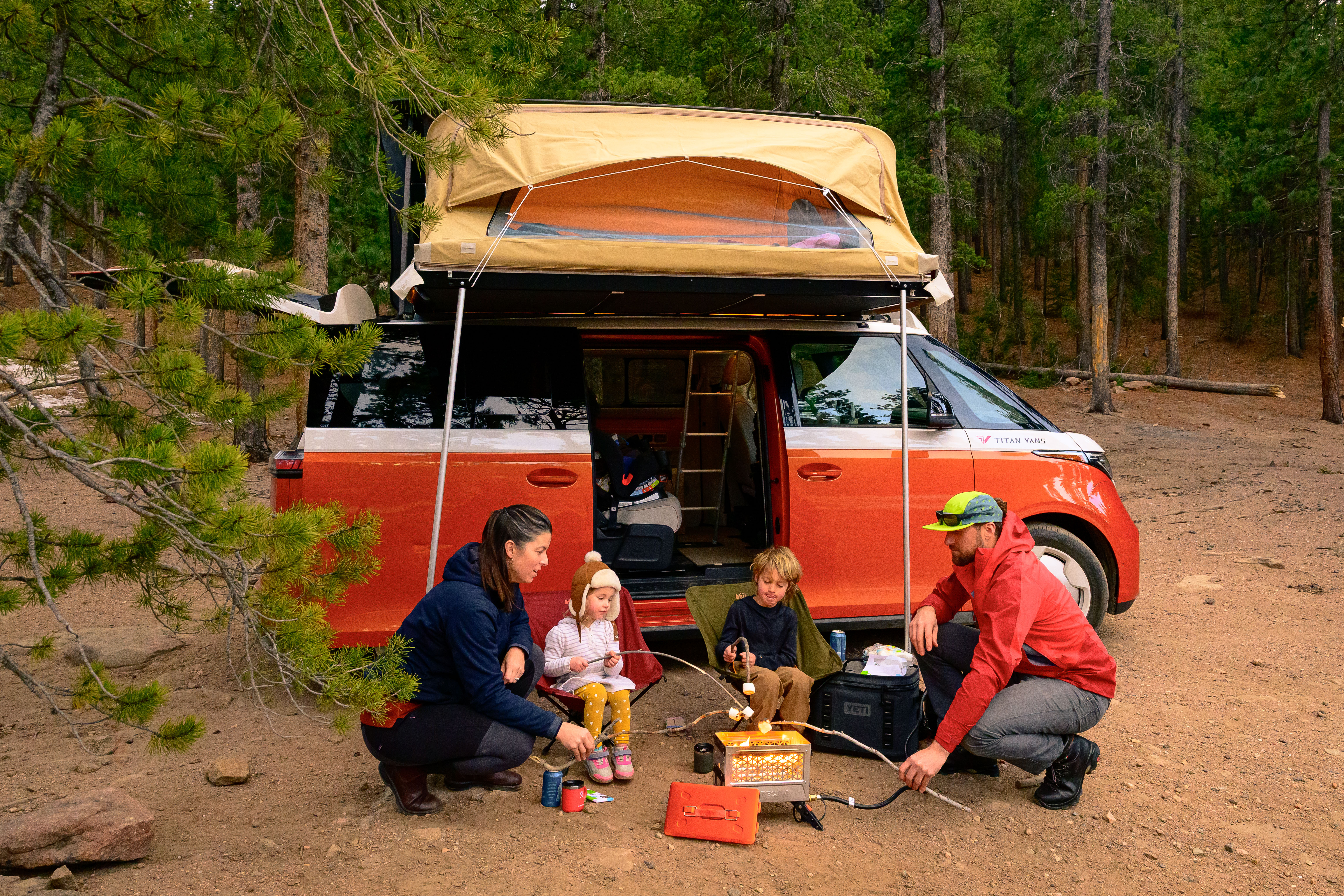 Kids playing around a Volkswagen ID.Buzz — Titan Vans