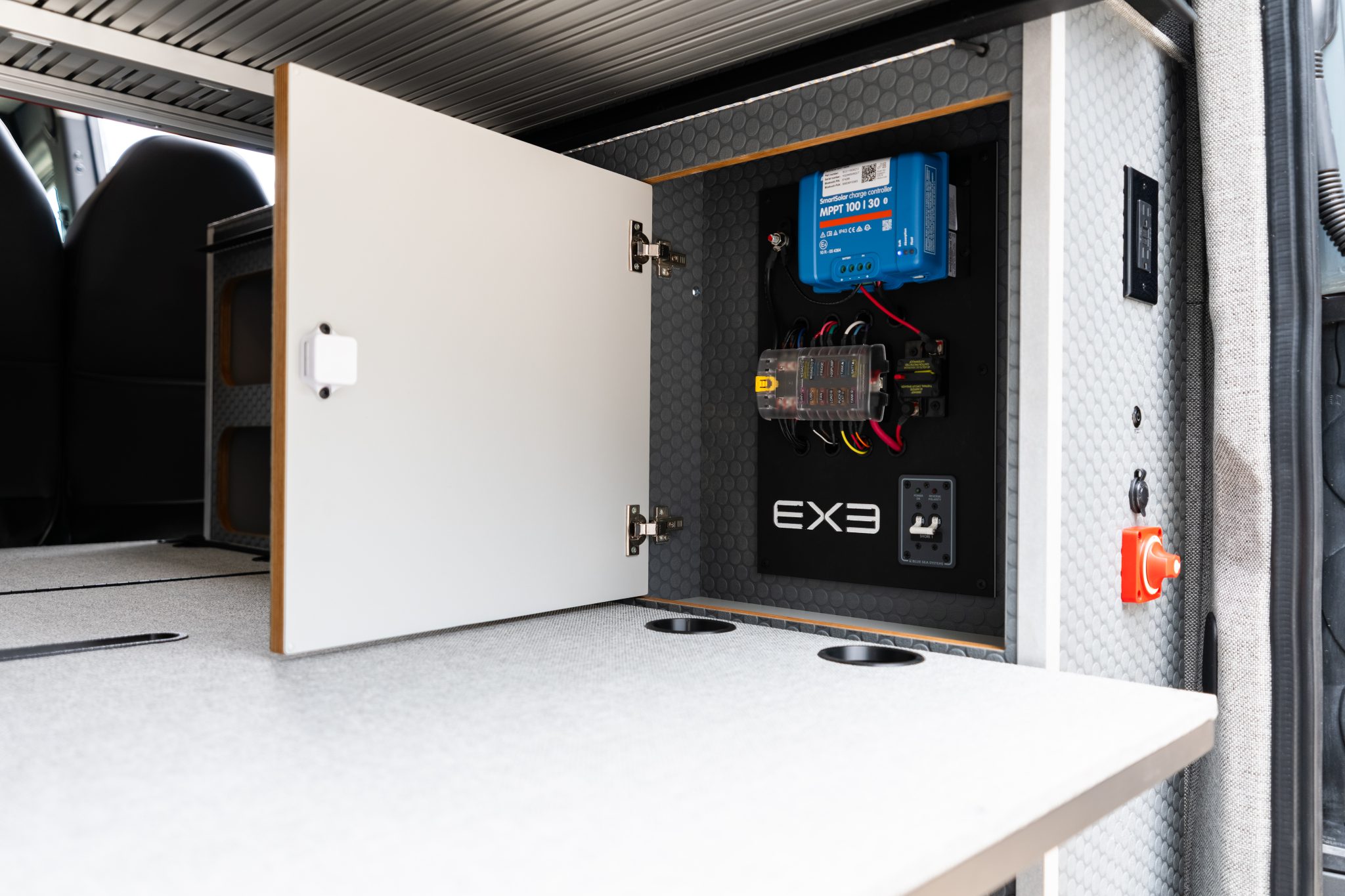 Camper van cabinet with the solar charge controller and fuse panel