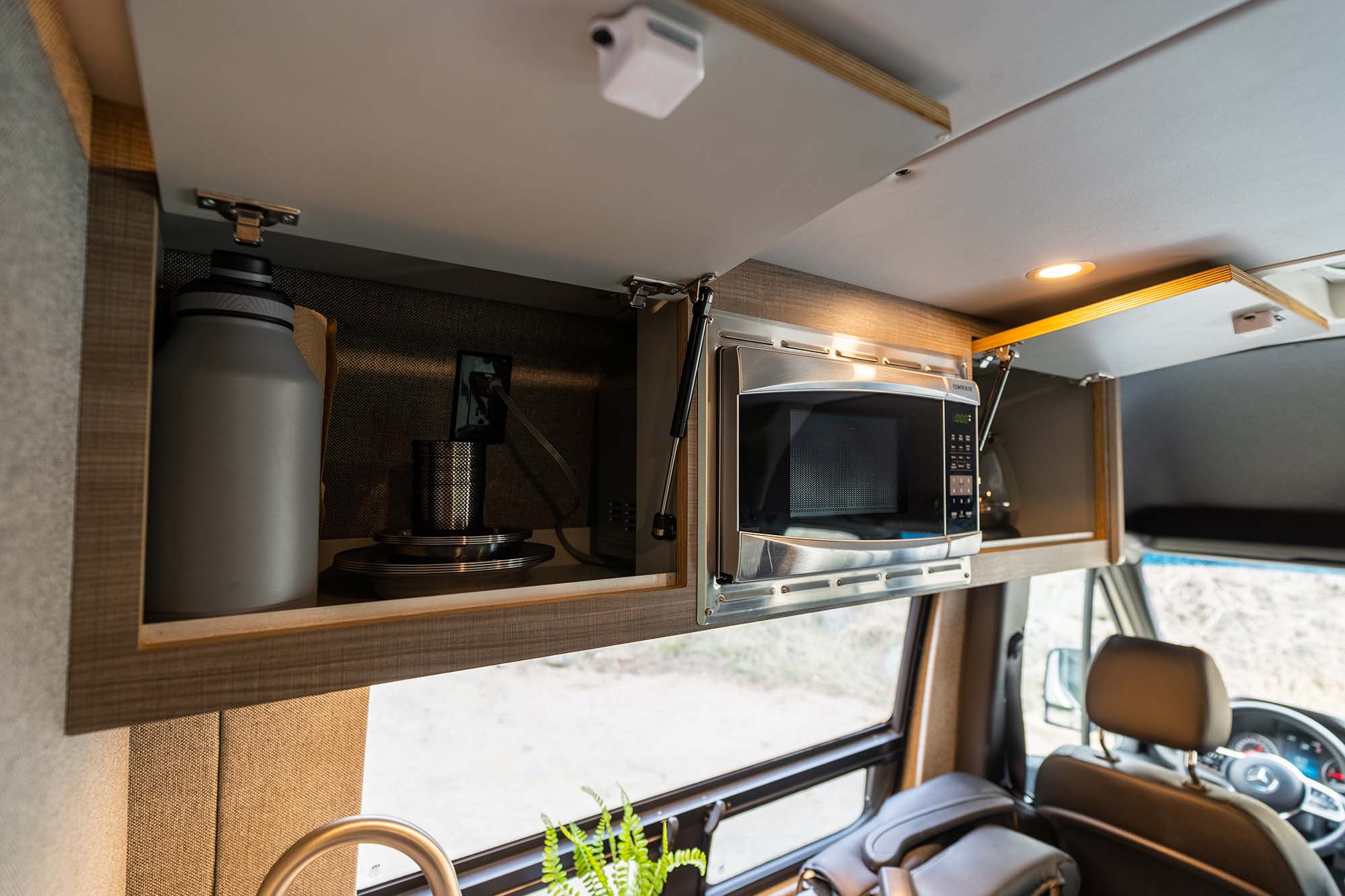 Camper van cabinets with microwave