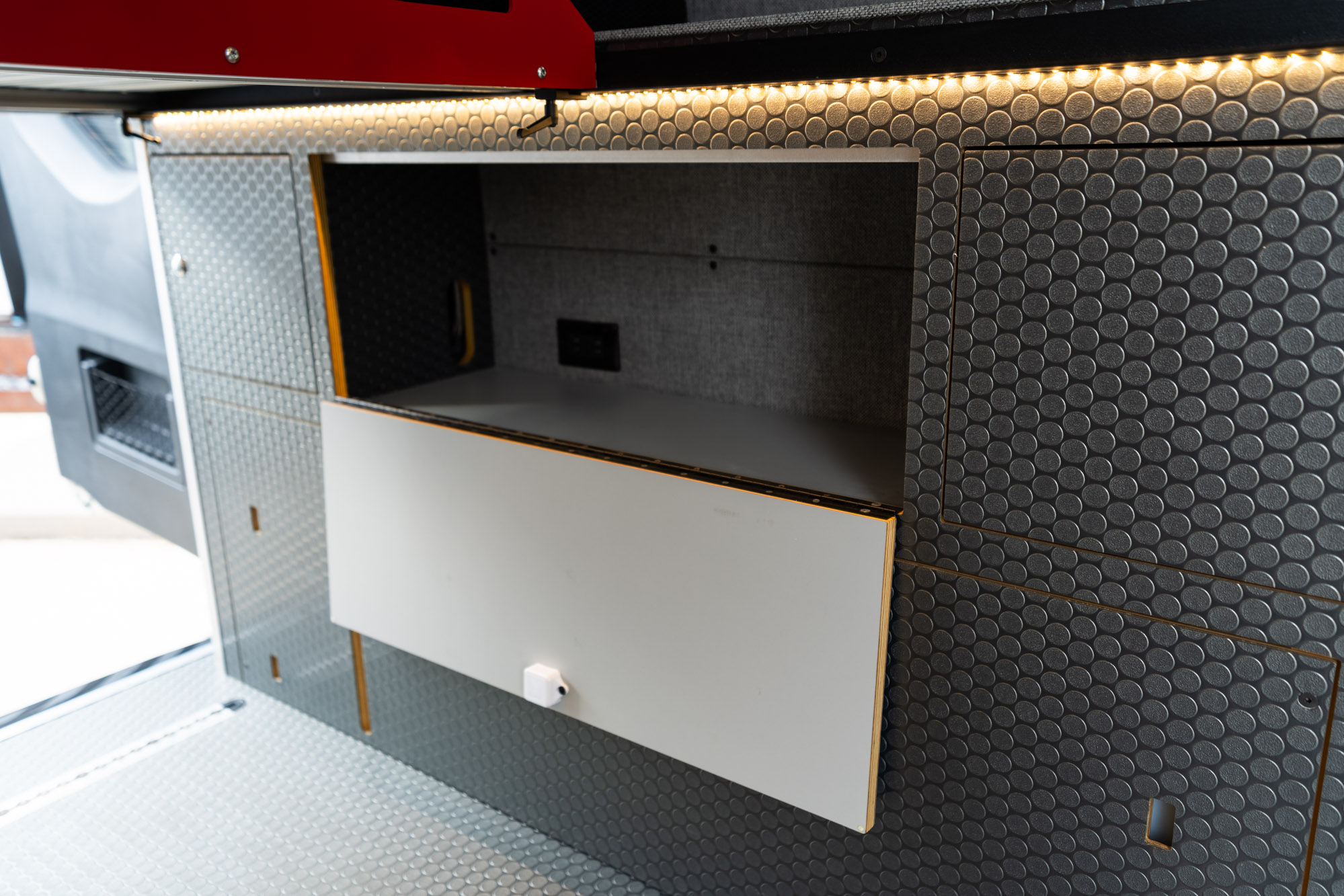 camper van wheel well storage