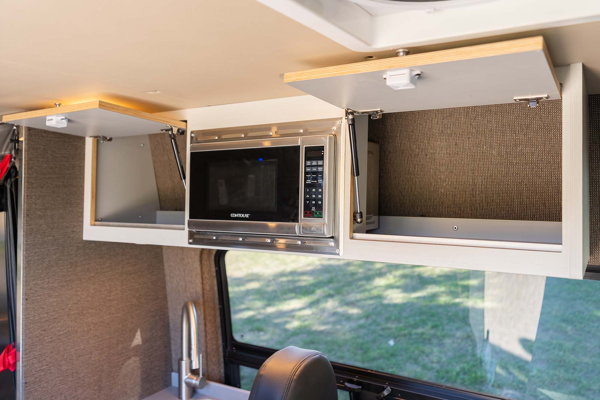 Camper van overhead cavbinets and microwave