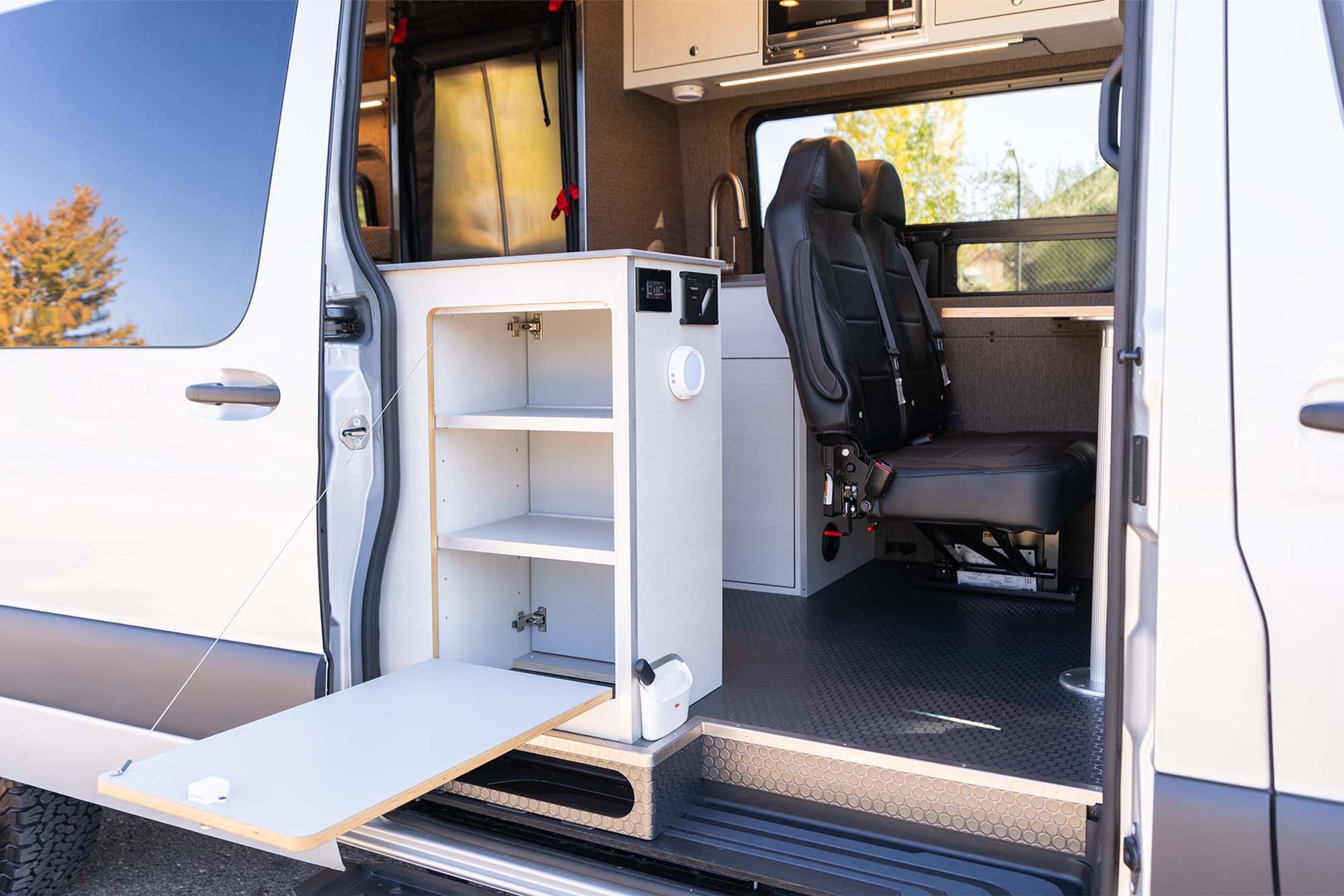 Camper van slider door open with exterior fold-down table 