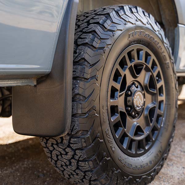mudflaps behind tire on camper van