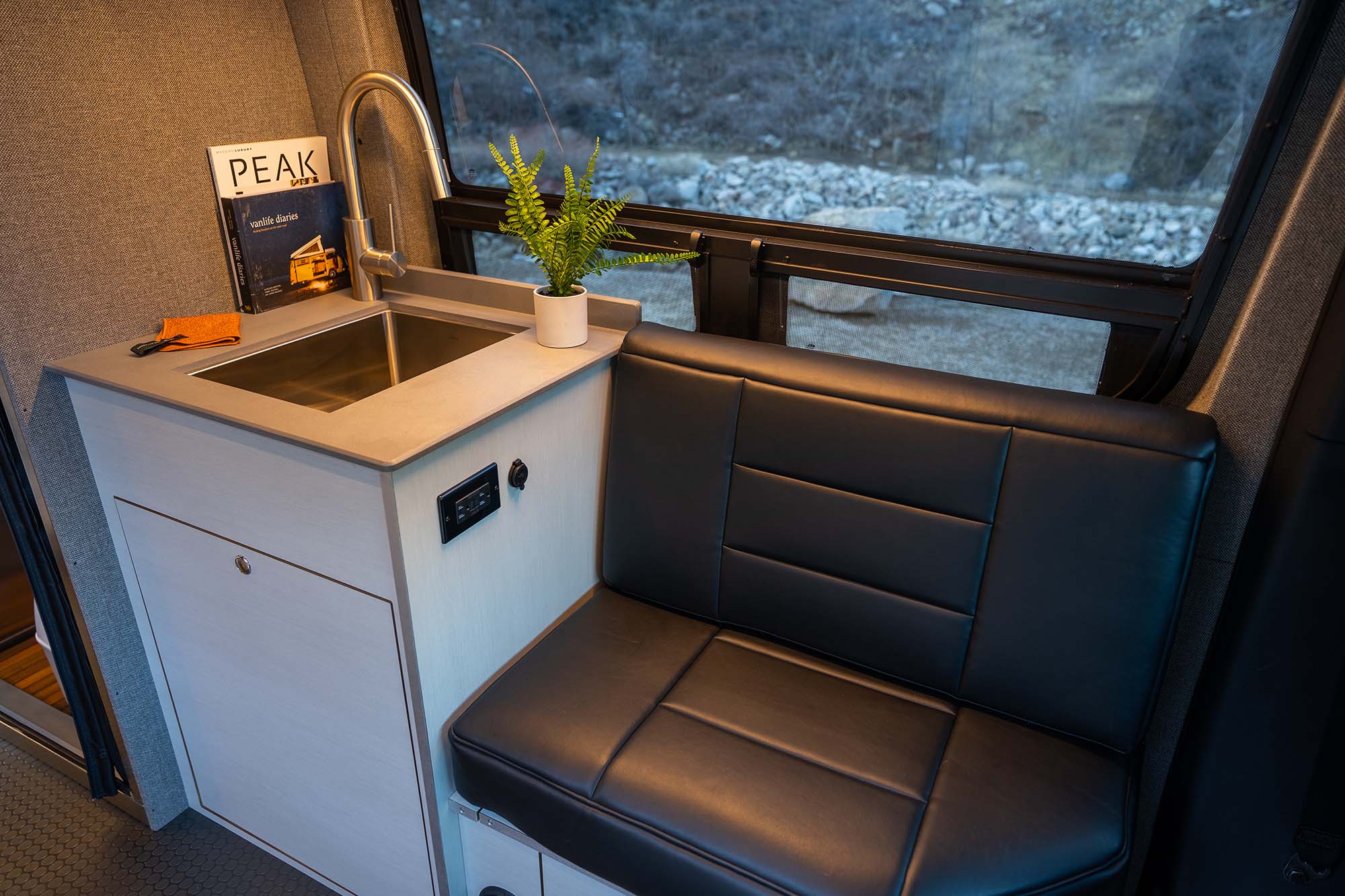 Rear couch and galley in an Ultra camper van